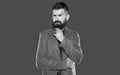 bearded pondering man wear casual on grey background Royalty Free Stock Photo