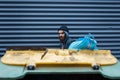 Bearded poor searching food in trashcan