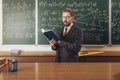 Bearded Professor in Suit and Glasses Citing a Manual