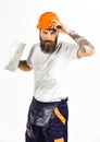 Bearded repairman with serious face and dirty boilersuit, white background. Royalty Free Stock Photo