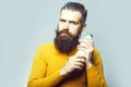 Bearded serious man with milk bottle Royalty Free Stock Photo