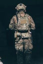 A bearded soldier in uniform of special forces in a dangerous military action in a dangerous enemy area. Selective focus Royalty Free Stock Photo