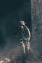 A bearded soldier in uniform of special forces in a dangerous military action in a dangerous enemy area. Selective focus Royalty Free Stock Photo