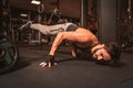 A bearded sporty man in the gym is doing Yoga exercises. Royalty Free Stock Photo