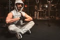 A bearded sporty man in the gym is meditating in a lotus position. Royalty Free Stock Photo