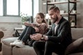 Bearded stepfather feeling concerned about quarrel with teenage girl