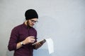 Bearded student guy holding a pencil and notebook. Royalty Free Stock Photo