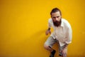 Bearded and tattooed man posing in fashion style