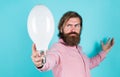 Bearded thinking man hold bulb. Energy saving. innovative idea and innovation. modern thinking. Solution to problem. new Royalty Free Stock Photo