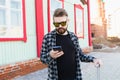 Bearded tourist man lost in city and using smartphone online map to find right directions. Travel and trip concept. Royalty Free Stock Photo