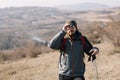 Bearded tourist using binoculars with hills view Royalty Free Stock Photo