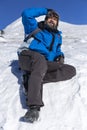 Bearded trekker resting while climbing Royalty Free Stock Photo