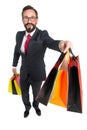 Bearded young businessman made shopping and holding colored paper bags in sale and market opportunity concept. Discounts season Royalty Free Stock Photo