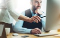 Bearded young businessman working on office. Director man thinking looking in monitor computer. Managers meeting. Idea, alalyze ma Royalty Free Stock Photo