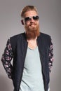 Bearded young man smiles at you Royalty Free Stock Photo