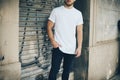 Bearded young man wearing white blank t-shirt and Royalty Free Stock Photo