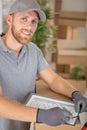 beared delivery man signing checklist Royalty Free Stock Photo