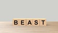 Beast - word wooden cubes on table horizontal over gray background HD Royalty Free Stock Photo