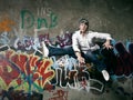 When the beat breaks free. Shot of a teenager breakdancer jumping against a spray painted wall.