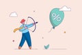 Beat inflation concept. Economic risk or investment bubble. Businessman shoots balloons with an arrow. Federal Reserve