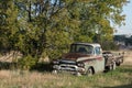 Beat Up Old Rusty Pick Up Truck Parked Under a Tree Royalty Free Stock Photo