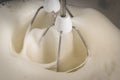 Beaten egg whites with a modern kitchen mixer used to beat the e Royalty Free Stock Photo
