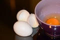 Beaten eggs in bowl with salt