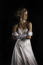 Beatiful bride in wedding dress with gloves