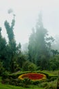 Beatiful designed park flower bed with mist the bryant park. Royalty Free Stock Photo