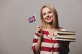 Beatiful girl holds British flag and books