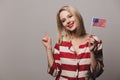 Beatiful girl holds United States of America flag