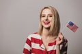 Beatiful girl holds United States of America flag