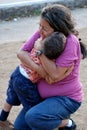 Beatiful Hispanic mother and child hugging Royalty Free Stock Photo