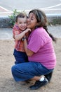 Beatiful Hispanic mother and child hugging