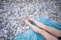 Beatiful legs on the beach with blue towel