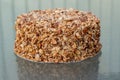 Beatiful nut biscuit cake finished with crushed sugar-coated candied caramelized almonds Royalty Free Stock Photo