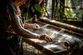 Artisan weaving in sunlit workshop Royalty Free Stock Photo