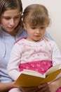 Beatiful sisters reading book Royalty Free Stock Photo