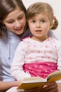 Beatiful sisters reading book Royalty Free Stock Photo