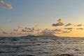 Beatiful sunset of ending summer on the Naples Coast, Procida and Ischia Islands on background Royalty Free Stock Photo