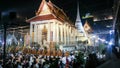 Beatiful temple Wat Swannaram in a cerimony with a olot of monks. People connected with white lines