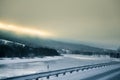 A beatiful winter scenery with a road. Woods in Norway. Royalty Free Stock Photo