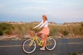 Beatiful woman with bike on the beach Royalty Free Stock Photo