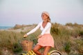 Beatiful woman with bike on the beach Royalty Free Stock Photo