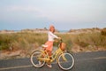 Beatiful woman with bike on the beach Royalty Free Stock Photo