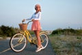 Beatiful woman with bike on the beach Royalty Free Stock Photo