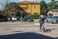 Beatiful woman riding a bike in Verona