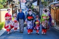 Beatiful woman and two small girls in Maiko kimono dress