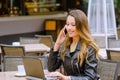 Beatiful young woman smiling and talking on smartphone Royalty Free Stock Photo