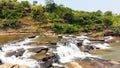 waterfall is an area where water flows over a vertical drop or a series of steep drops in the course of a stream or river